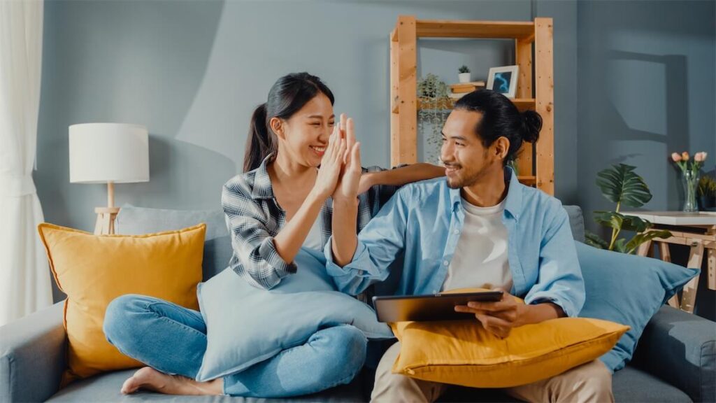  A happy couple after checking their grants and subsidies eligibility for their upcoming HDB BTO application in Singapore