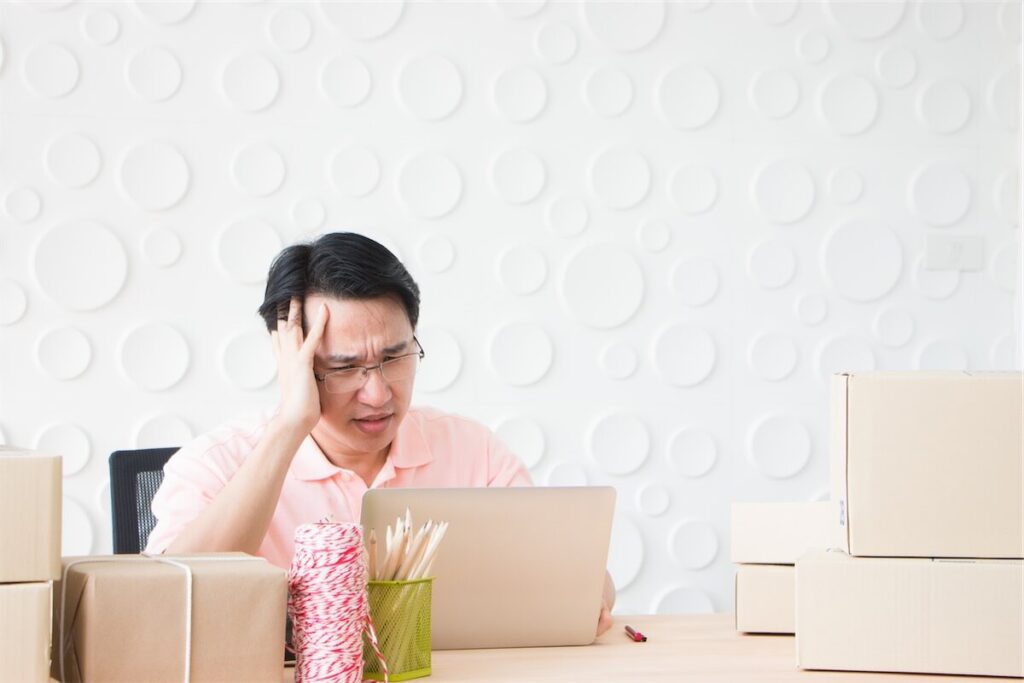 Man with a headache trying to understand his HDB cash over valuation