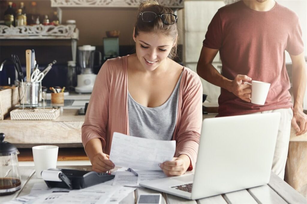 Young couple at home researching on home loan packages in Singapore and their IPA terms