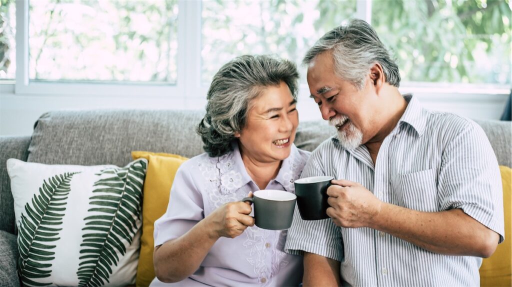 An elderly couple enjoying their coffee in their private property retirement home in Singapore