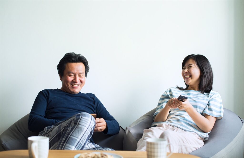 Couple relaxing in their condo located in Singapore’s CCR