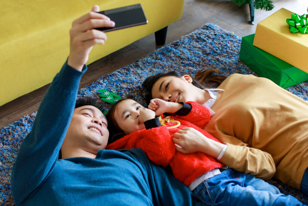 Image of a family of three enjoying some bonding time in their new condo