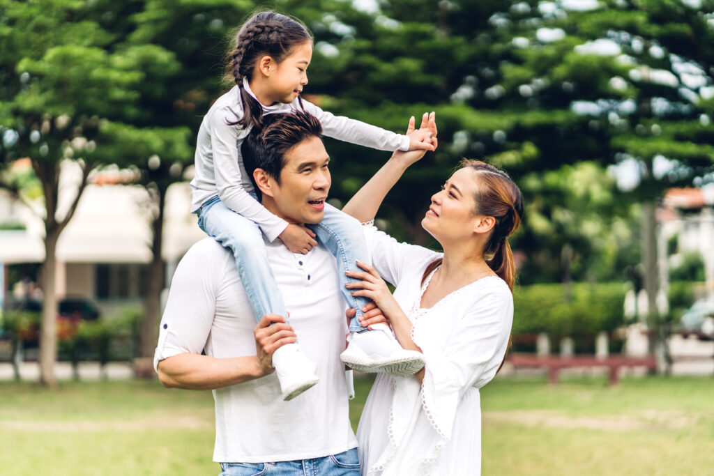 Family enjoying time in the park near their new condo in Singapore