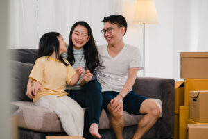 Happy family moving into their new condo in Singapore after applying these great home hunting tips