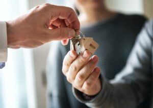 Couple collecting their keys to their affordable private housing in Singapore
