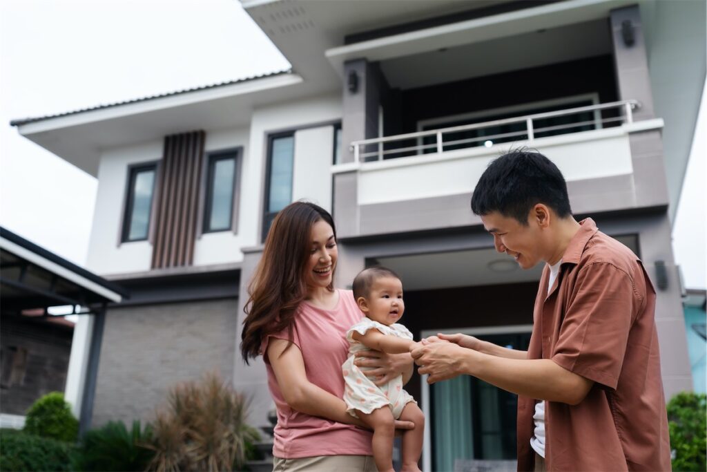  Image of a married couple and their baby upgrading from their first home in Singapore into a landed property in Singapore, after proper financial planning with a home loan advisor.