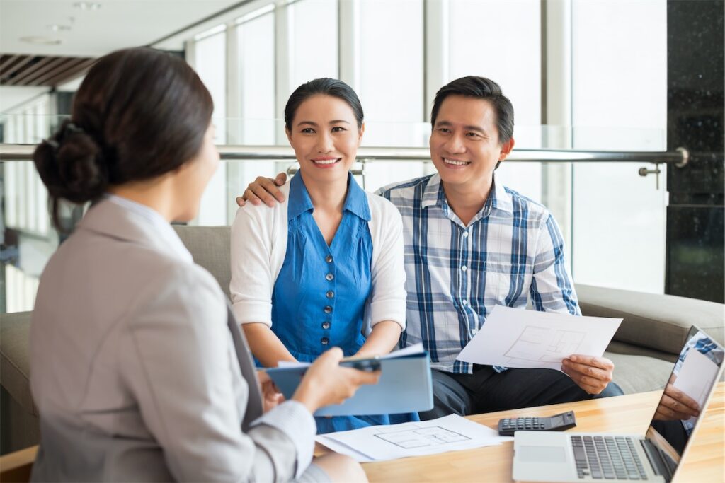 Image of a married couple upgrading themselves to priority banking status with their local bank